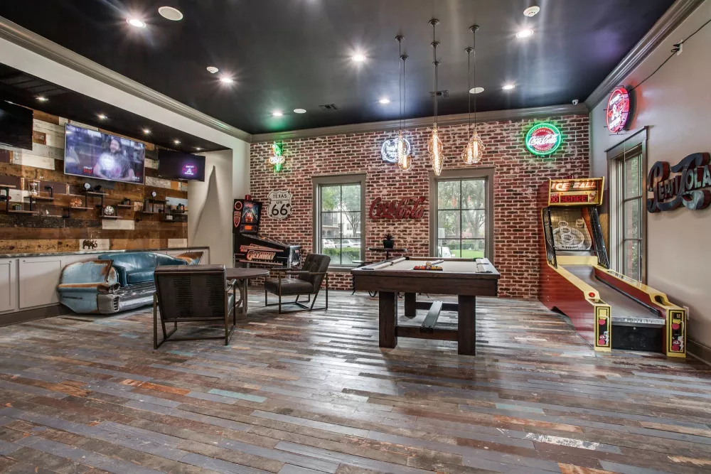 Large, expansive game room with multiple arcade and bar games in Irving, Texas.
