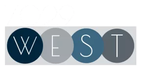 7029 WEST logo. "7029" in white text above "WEST" in white letters on four colored circles.